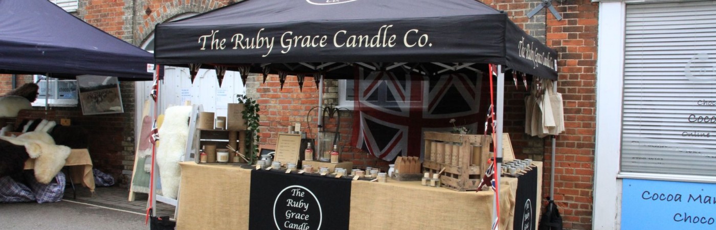 The Ruby Grace Candle Company at the Queen Elizabeth ll Platinum Jubilee Street Party Eye Town Suffolk. Candles of all types and colours, for wellness or dinner parties.