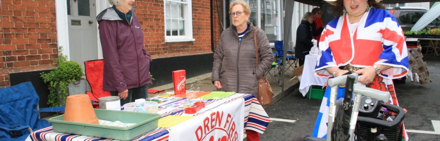 Patriotic lady on mobility scooter attends Queen Elizabeth ll Platinum Jubilee Street Party.