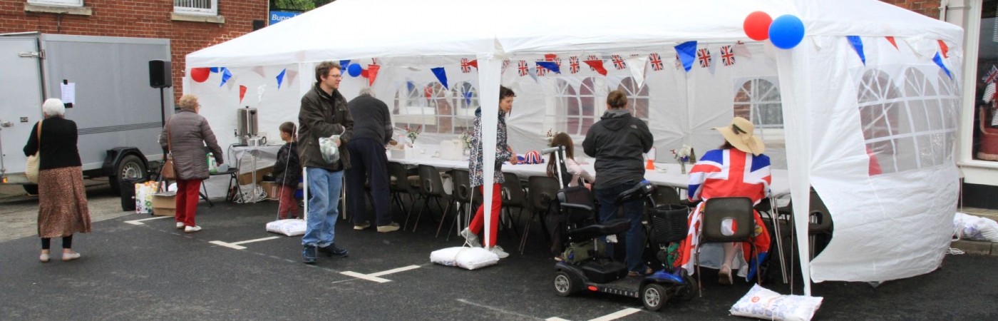 Volunteers prepare for the Big Jubilee Lunch on Broad Street Eye. The Eye Town Queen Elizabeth ll Jubilee Street Party.